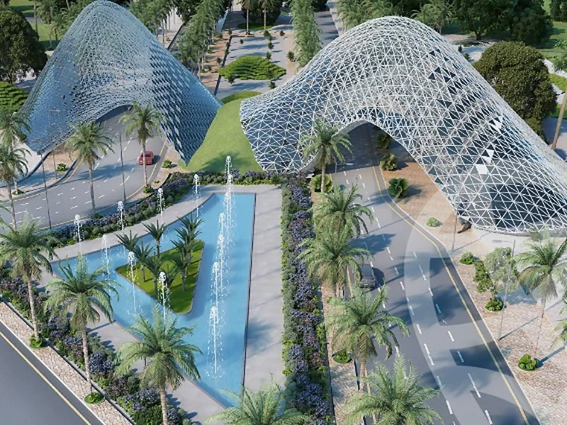 Rendering of the Mostakbal City main gate — twin lattice arches over the entrance road, a fountain pool and palm-lined gardens
